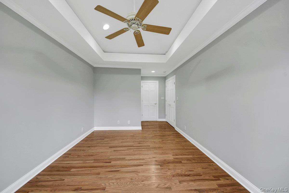 7 Rutledge Road Valhalla, NY 10595 - Photo 17 of 37 Spacious room featuring wood-finish flooring, light grey walls, and white trim
