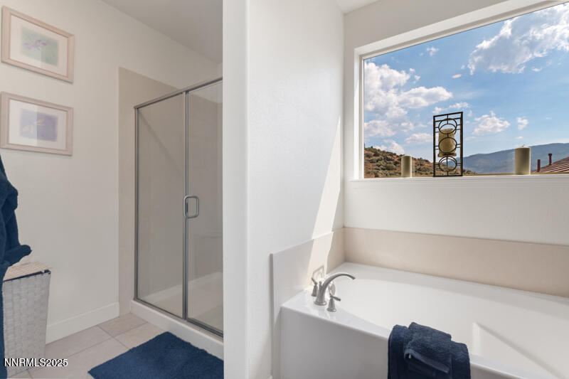 1590 Scott Valley Road Reno, NV 89523 - Photo 15 of 29 a bathroom with a tub and shower