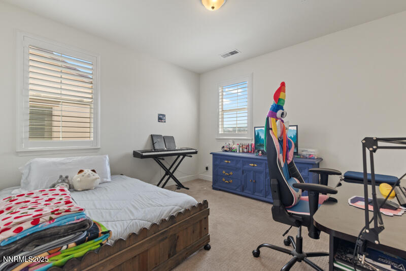 1590 Scott Valley Road Reno, NV 89523 - Photo 17 of 29 a bedroom with furniture and a window