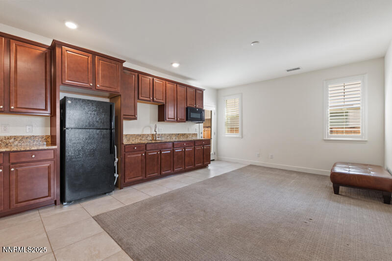 1590 Scott Valley Road Reno, NV 89523 - Photo 19 of 29 a kitchen with stainless steel appliances granite countertop a refrigerator and a stove