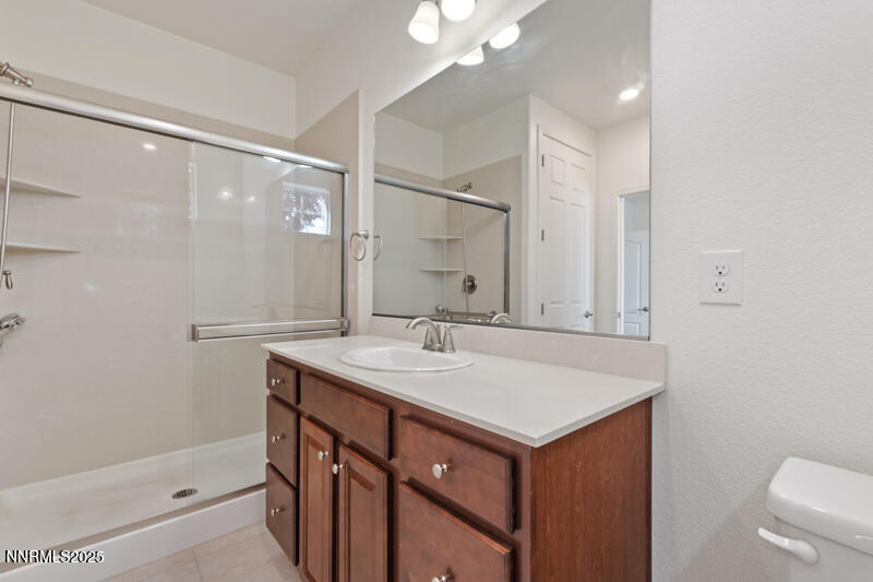 1590 Scott Valley Road Reno, NV 89523 - Photo 23 of 29 a bathroom with a sink and a mirror