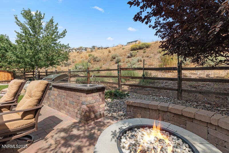 1590 Scott Valley Road Reno, NV 89523 - Photo 26 of 29 a view of swimming pool with a patio and wooden fence