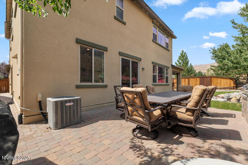 1590 Scott Valley Road Reno, NV 89523 - Photo 28 of 29 a view of a backyard with table and chairs