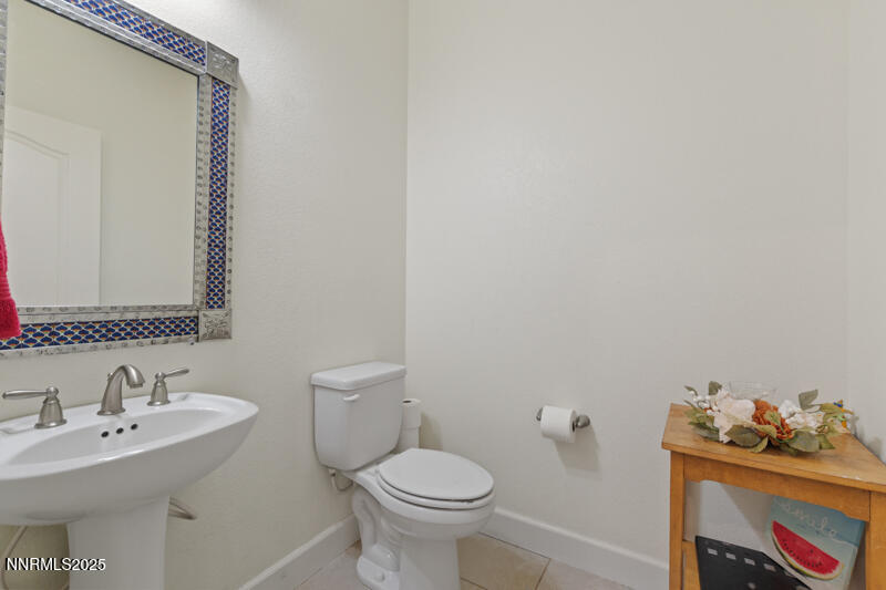 1590 Scott Valley Road Reno, NV 89523 - Photo 5 of 29 a bathroom with a sink toilet and a mirror