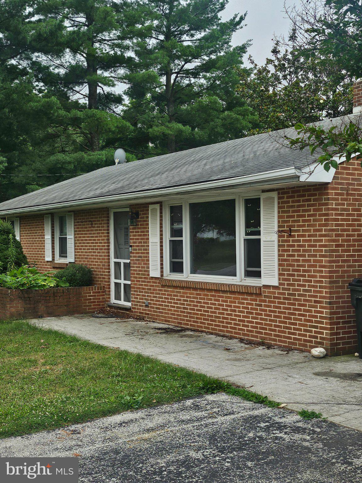 2400 Derry Road York, PA 17408 - Photo 1 of 1 Charming brick home with lush greenery.