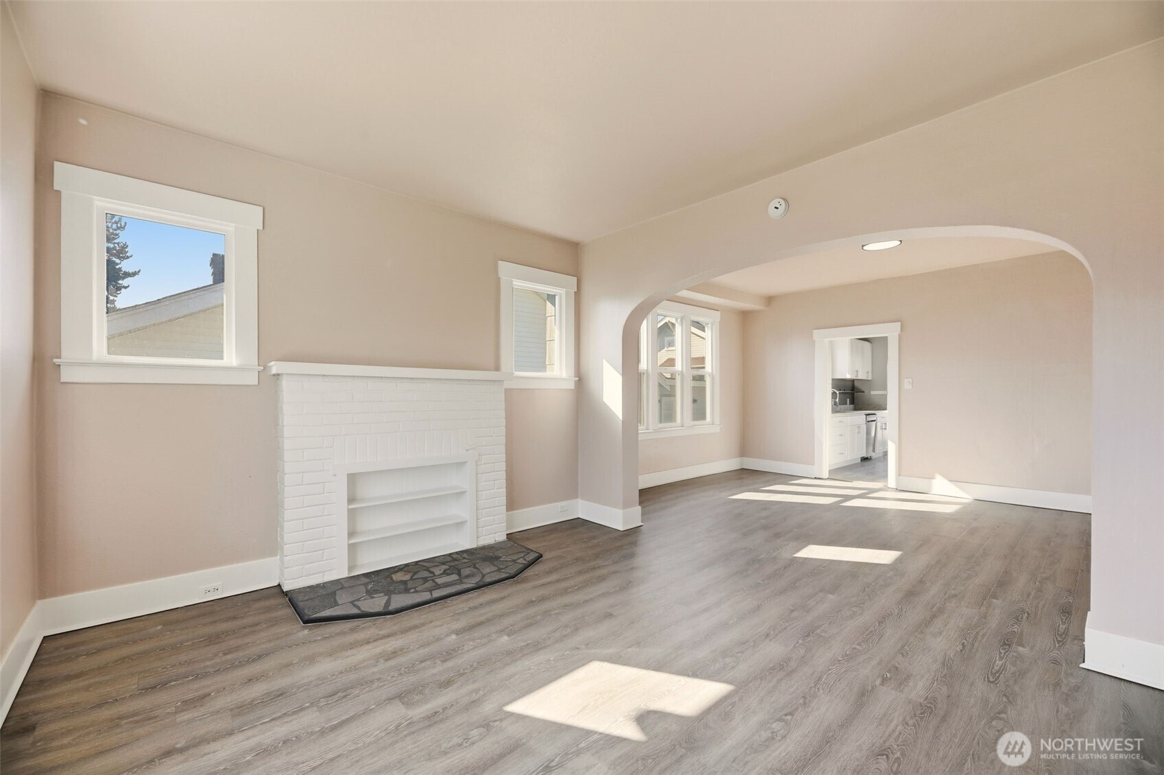 1726 Baker Avenue Everett, WA 98201 - Photo 11 of 39 an empty room with wooden floor and windows