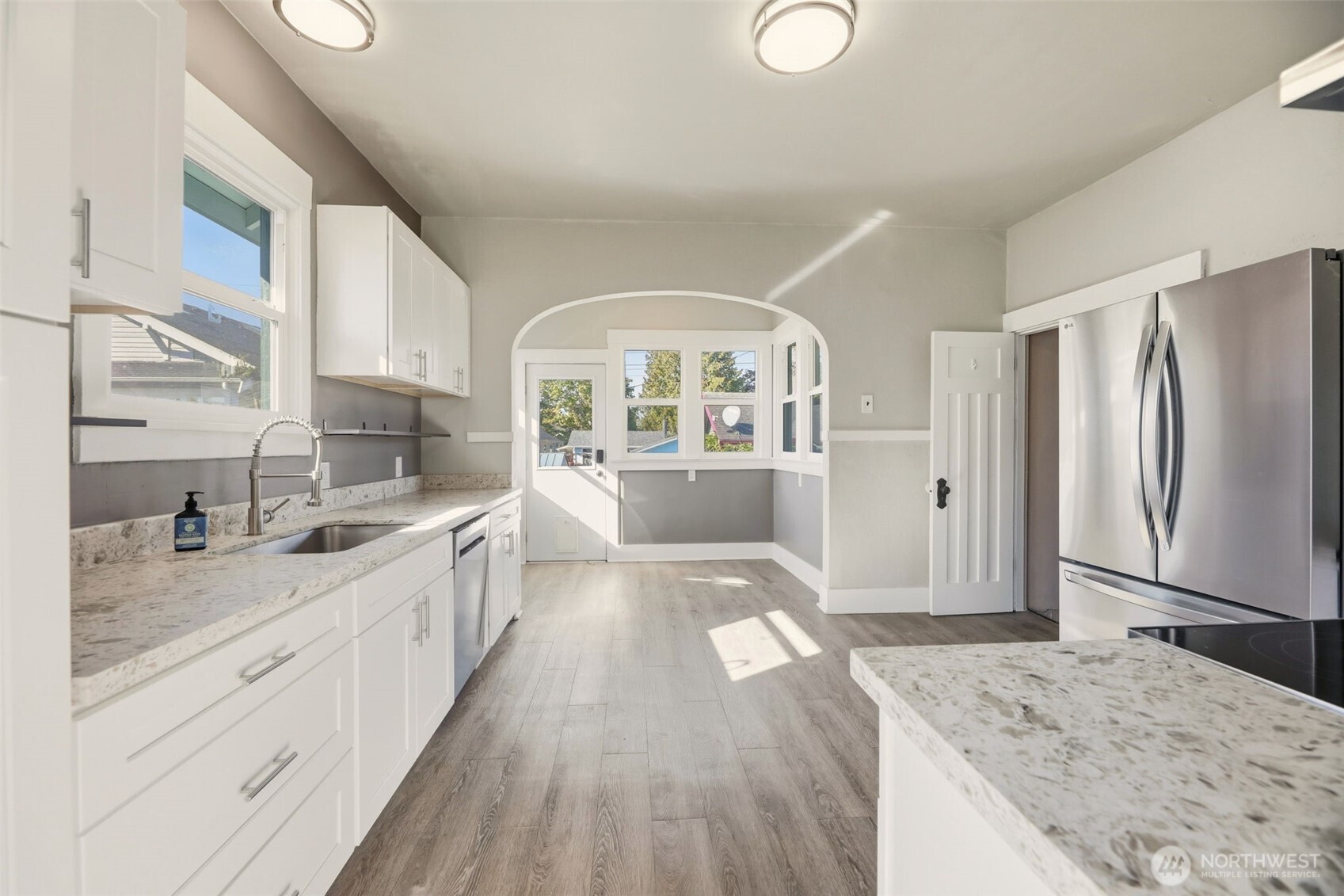 1726 Baker Avenue Everett, WA 98201 - Photo 16 of 39 a large kitchen with kitchen island a sink stainless steel appliances and cabinets