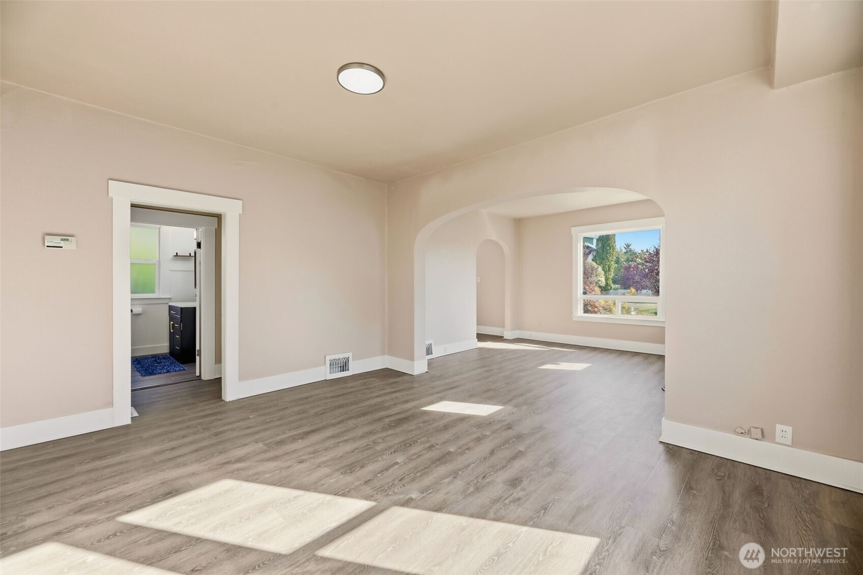 1726 Baker Avenue Everett, WA 98201 - Photo 19 of 39 an empty room with windows and entrance