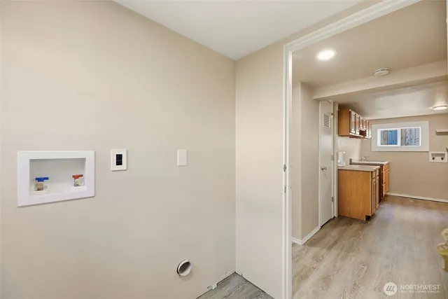 a view of a hallway with a kitchen