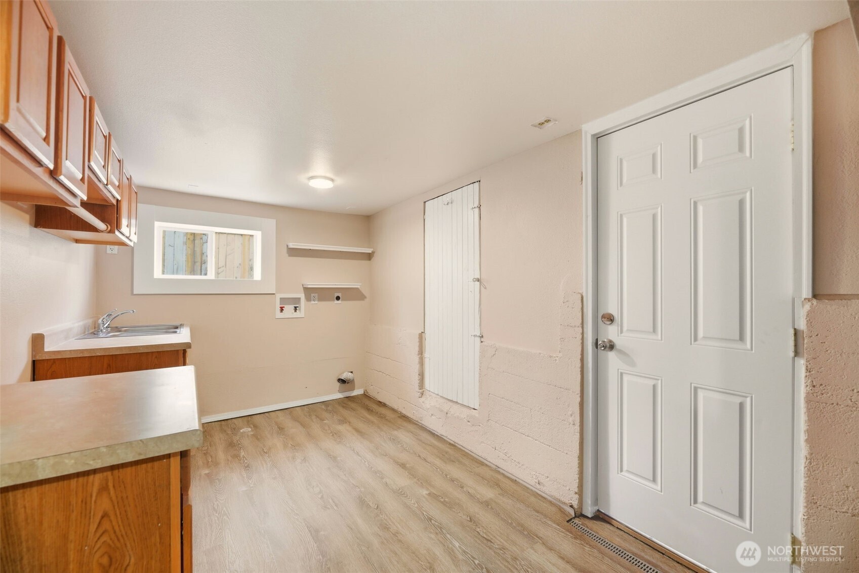 1726 Baker Avenue Everett, WA 98201 - Photo 25 of 39 a view of a room with wooden floor and electronic appliances