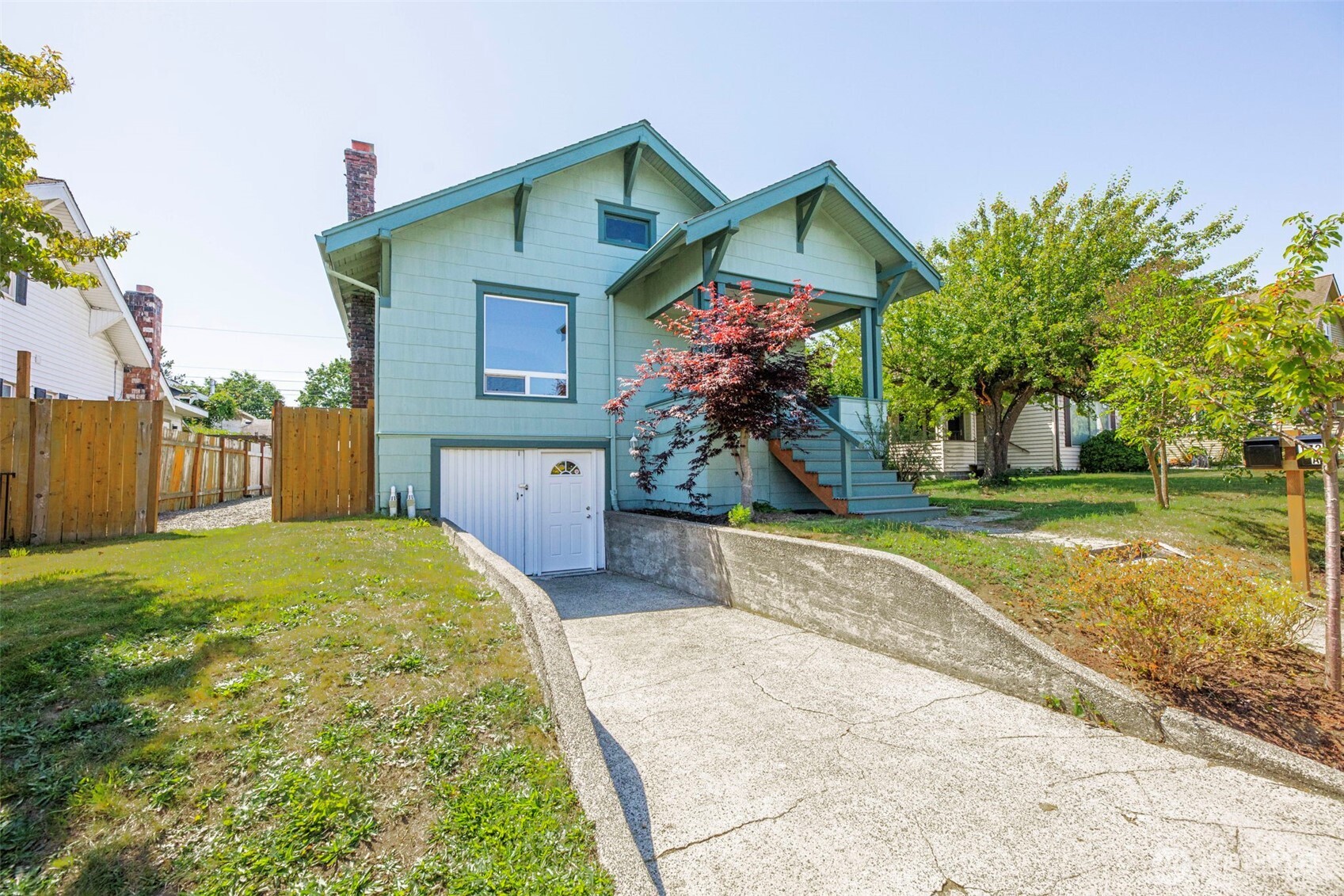 1726 Baker Avenue Everett, WA 98201 - Photo 4 of 39 a front view of a house with garden