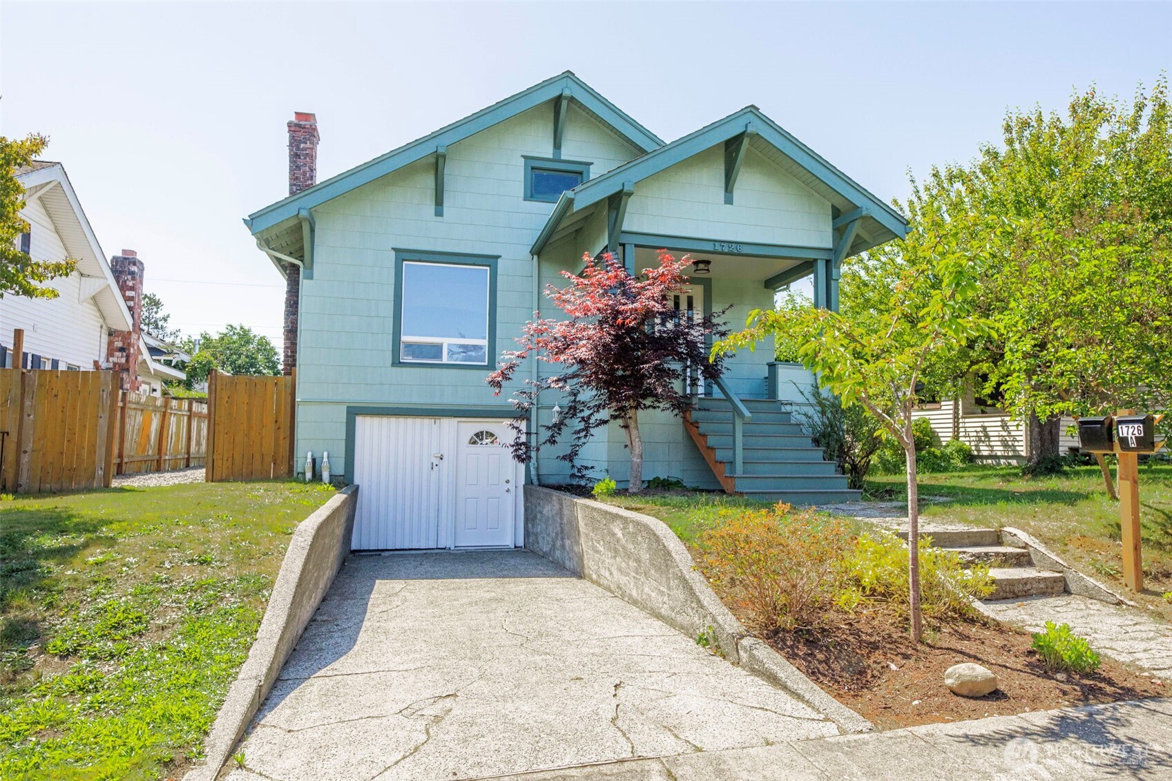 1726 Baker Avenue Everett, WA 98201 - Photo 5 of 39 a view of a house with a yard and potted plants