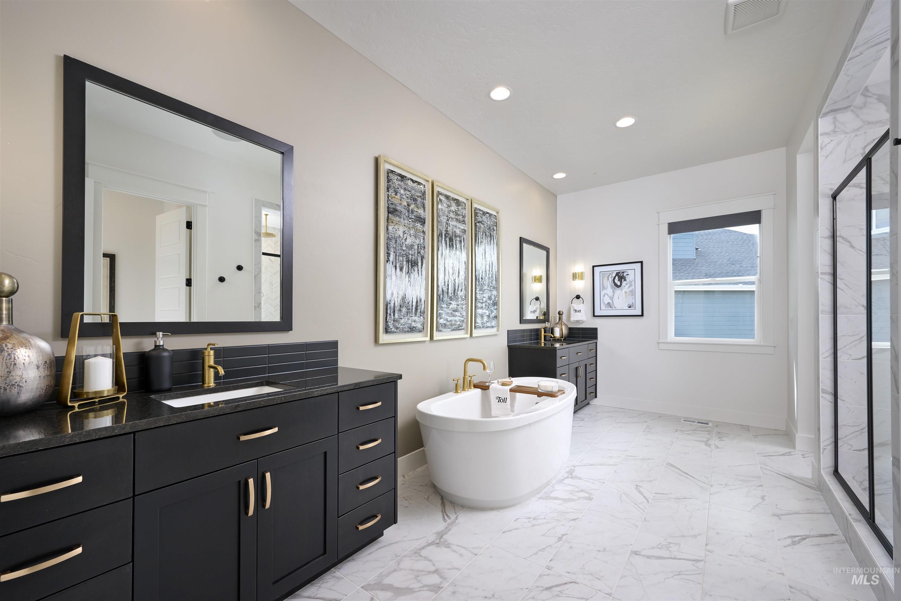 3370 North Del Sol Way Star, ID 83669 - Photo 13 of 30 Full bathroom with two vanities, light marble finish flooring, a freestanding bath, a stall shower, and recessed lighting