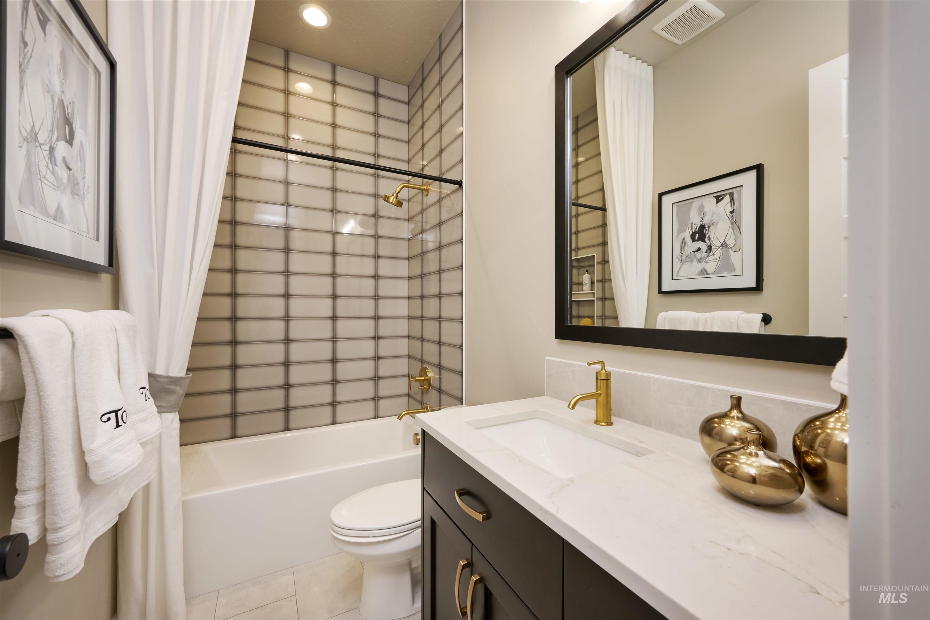 3370 North Del Sol Way Star, ID 83669 - Photo 16 of 30 Bathroom featuring vanity, shower / tub combo with curtain, recessed lighting, and light tile patterned flooring