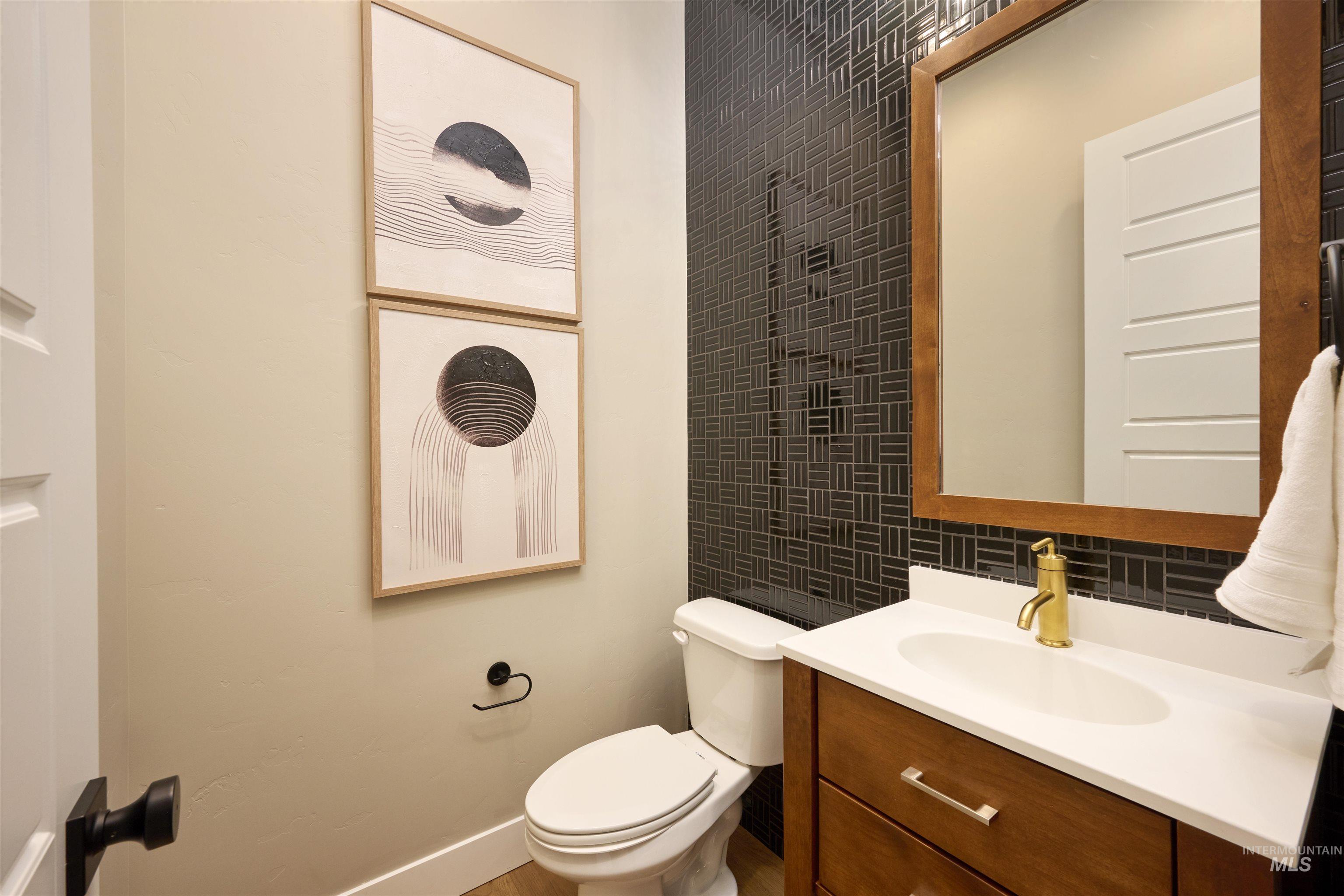 3370 North Del Sol Way Star, ID 83669 - Photo 18 of 30 Bathroom featuring vanity and tile walls
