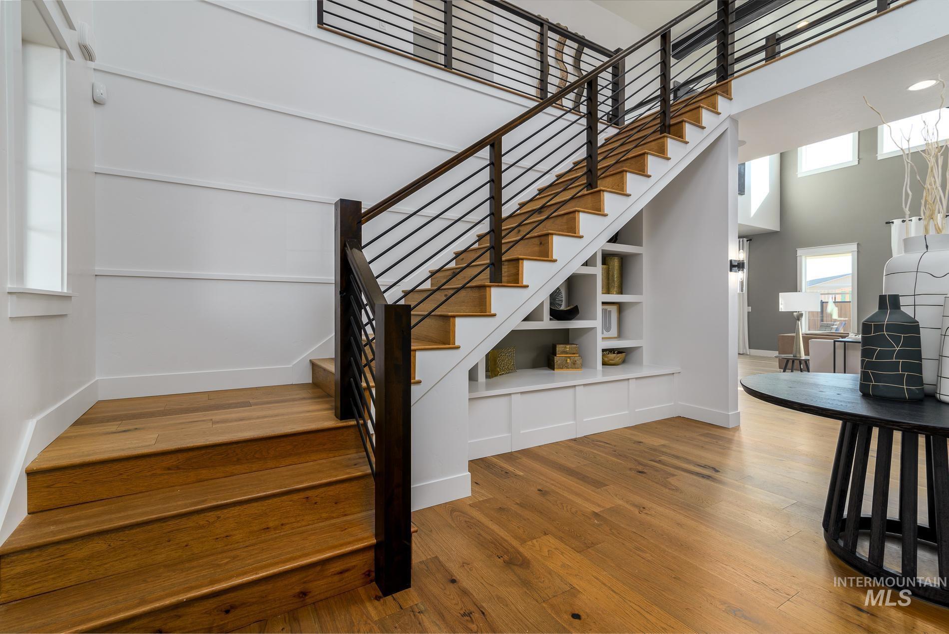 3370 North Del Sol Way Star, ID 83669 - Photo 19 of 30 Stairway with a high ceiling, hardwood / wood-style floors, and built in shelves
