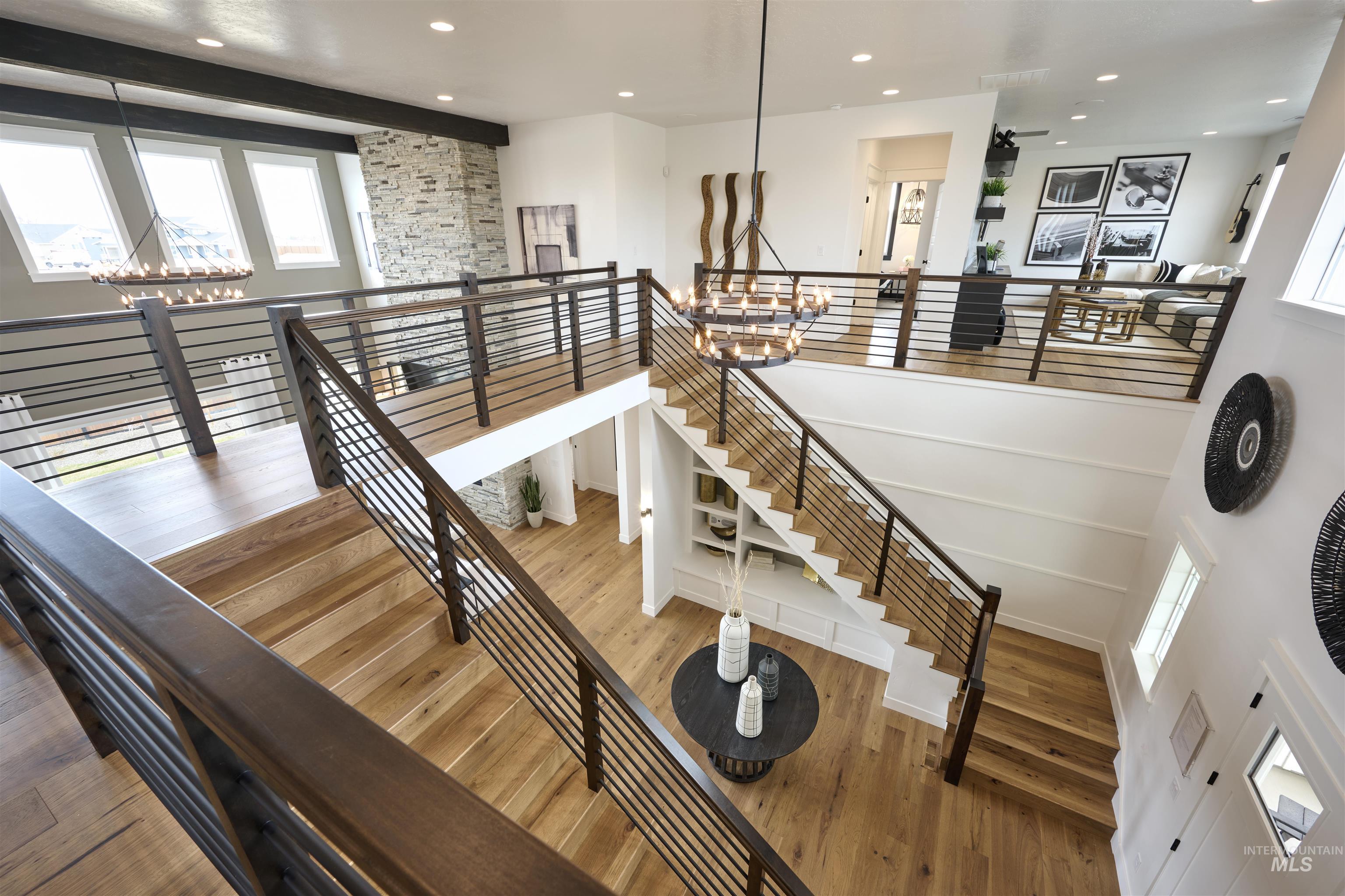 3370 North Del Sol Way Star, ID 83669 - Photo 22 of 30 Stairway featuring wood finished floors and a chandelier
