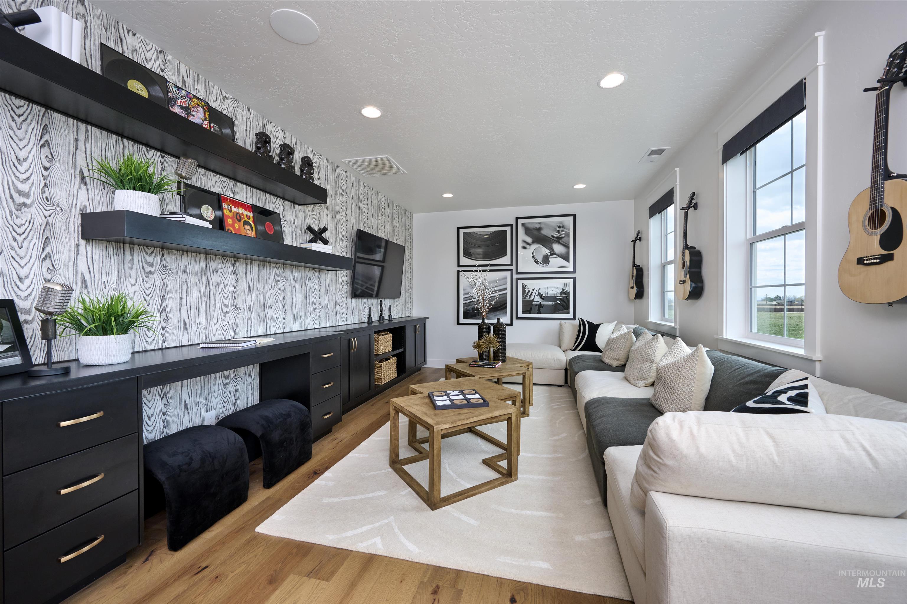 3370 North Del Sol Way Star, ID 83669 - Photo 23 of 30 Living area featuring light wood finished floors, recessed lighting, and an accent wall