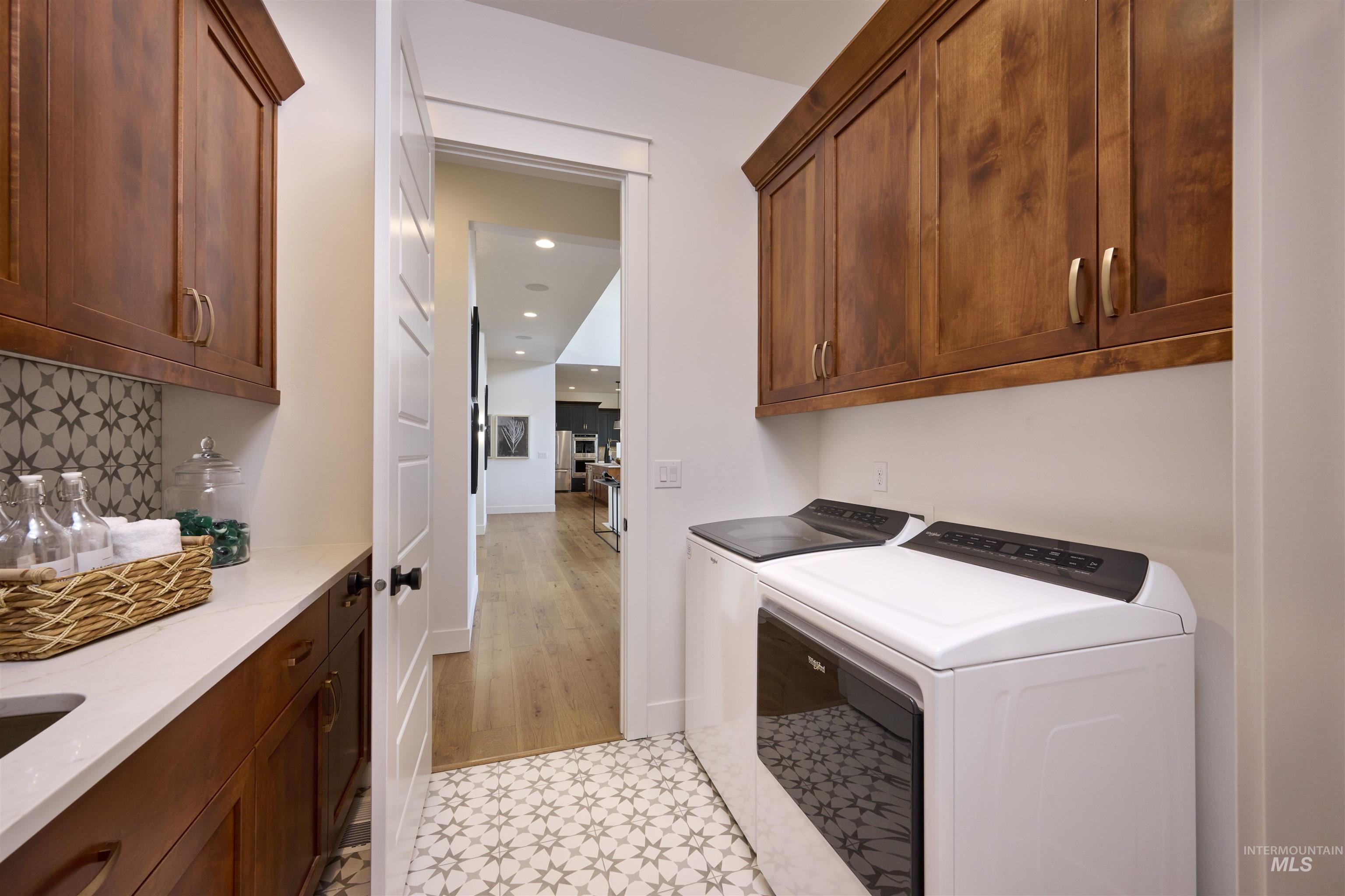 3370 North Del Sol Way Star, ID 83669 - Photo 29 of 30 Laundry room with cabinet space, independent washer and dryer, and recessed lighting