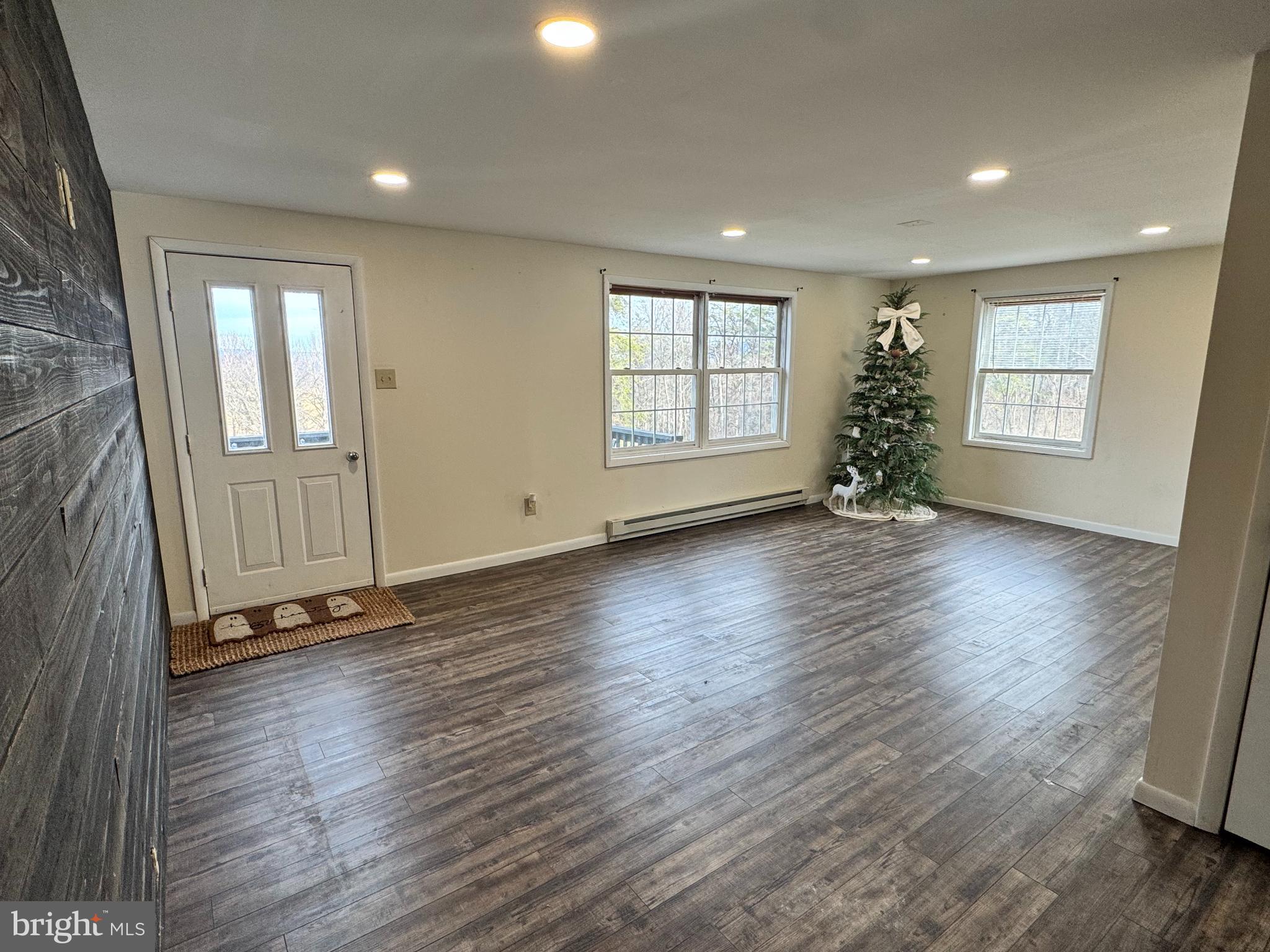 50 Irvin Road McVeytown, PA 17051 - Photo 6 of 19 an empty room with wooden floor and windows
