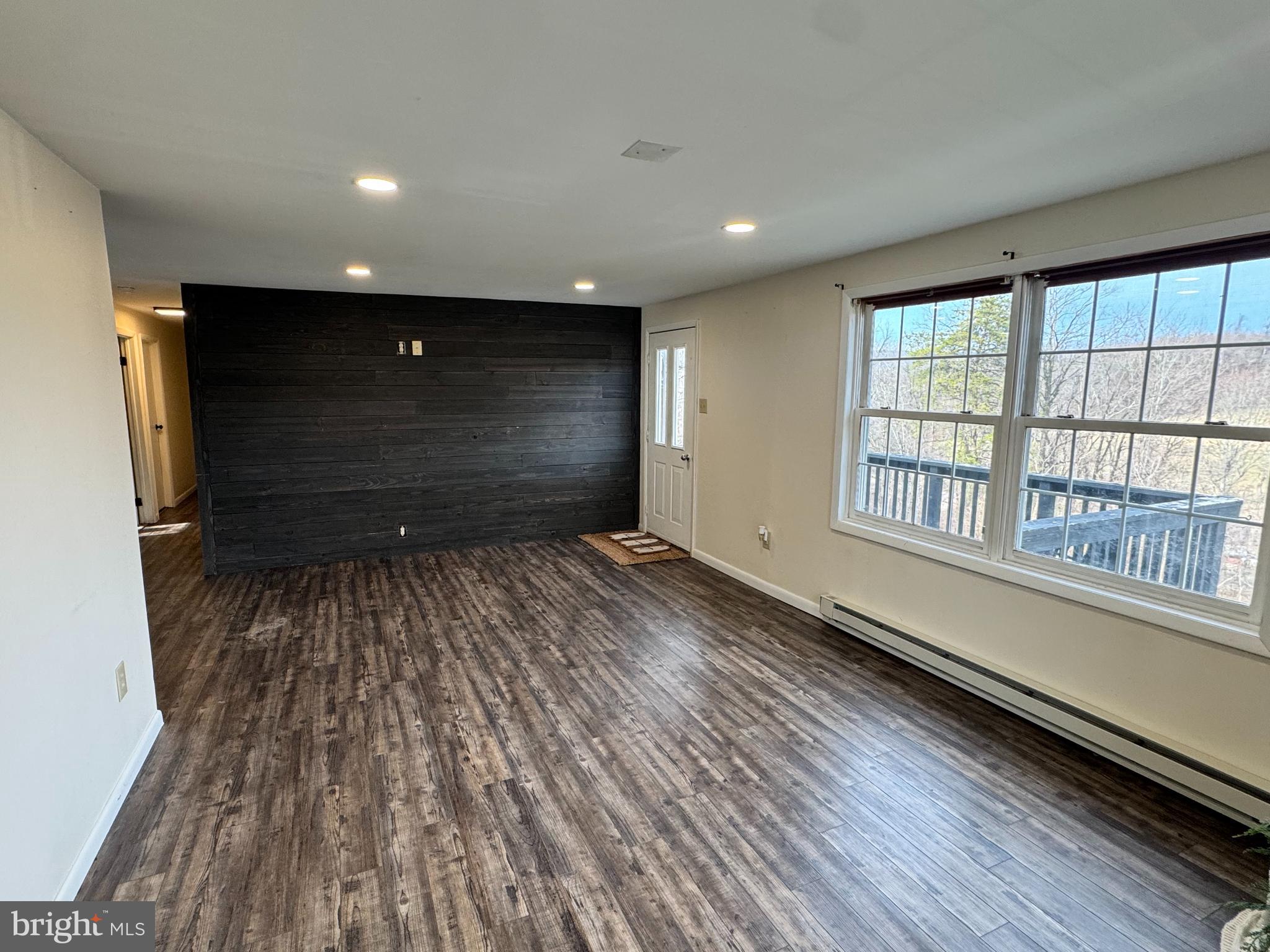 50 Irvin Road McVeytown, PA 17051 - Photo 7 of 19 a view of an empty room with wooden floor and a window