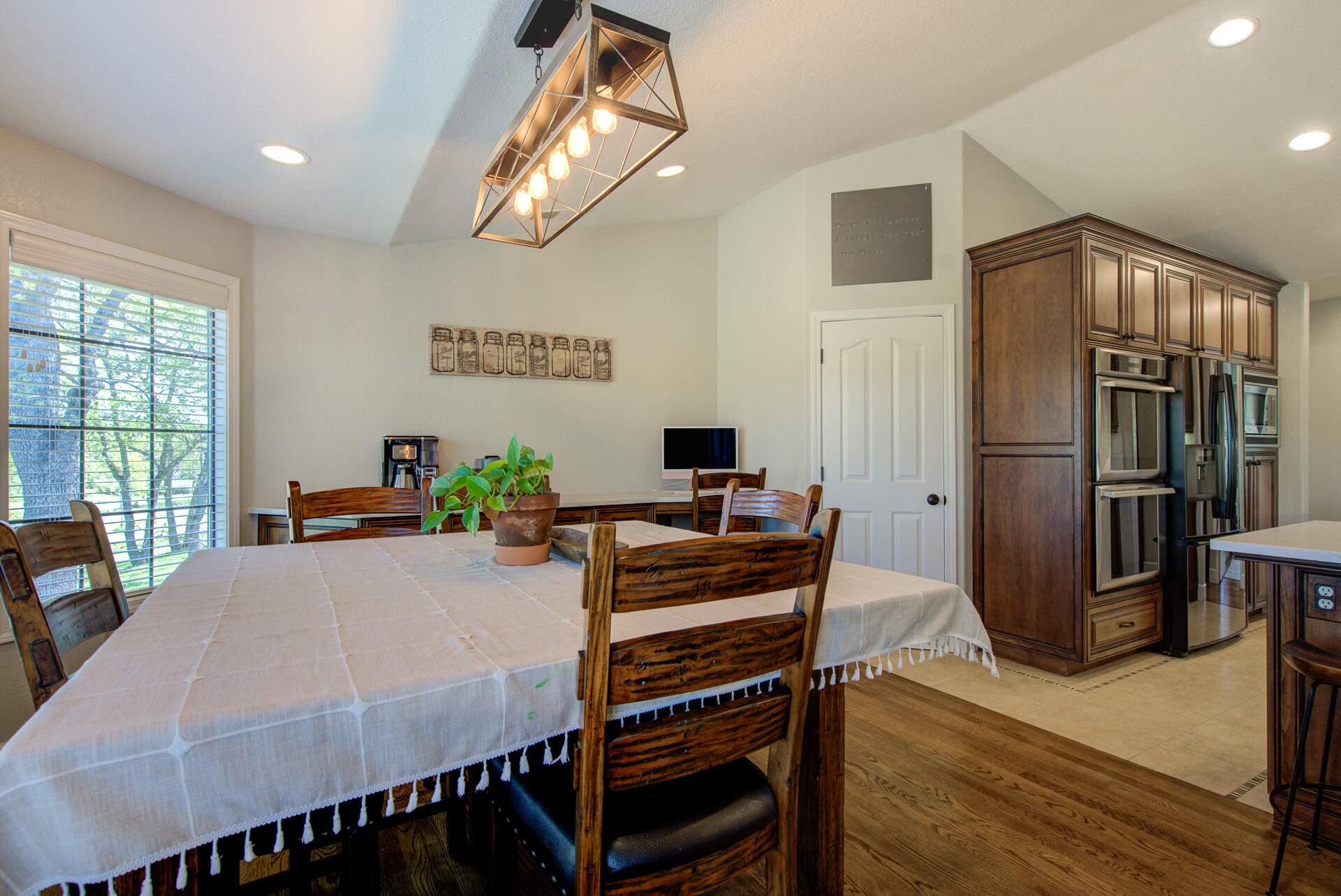 13416 Luna Drive Redding, CA 96003 - Photo 19 of 64 a view of a dining room with furniture window and wooden floor
