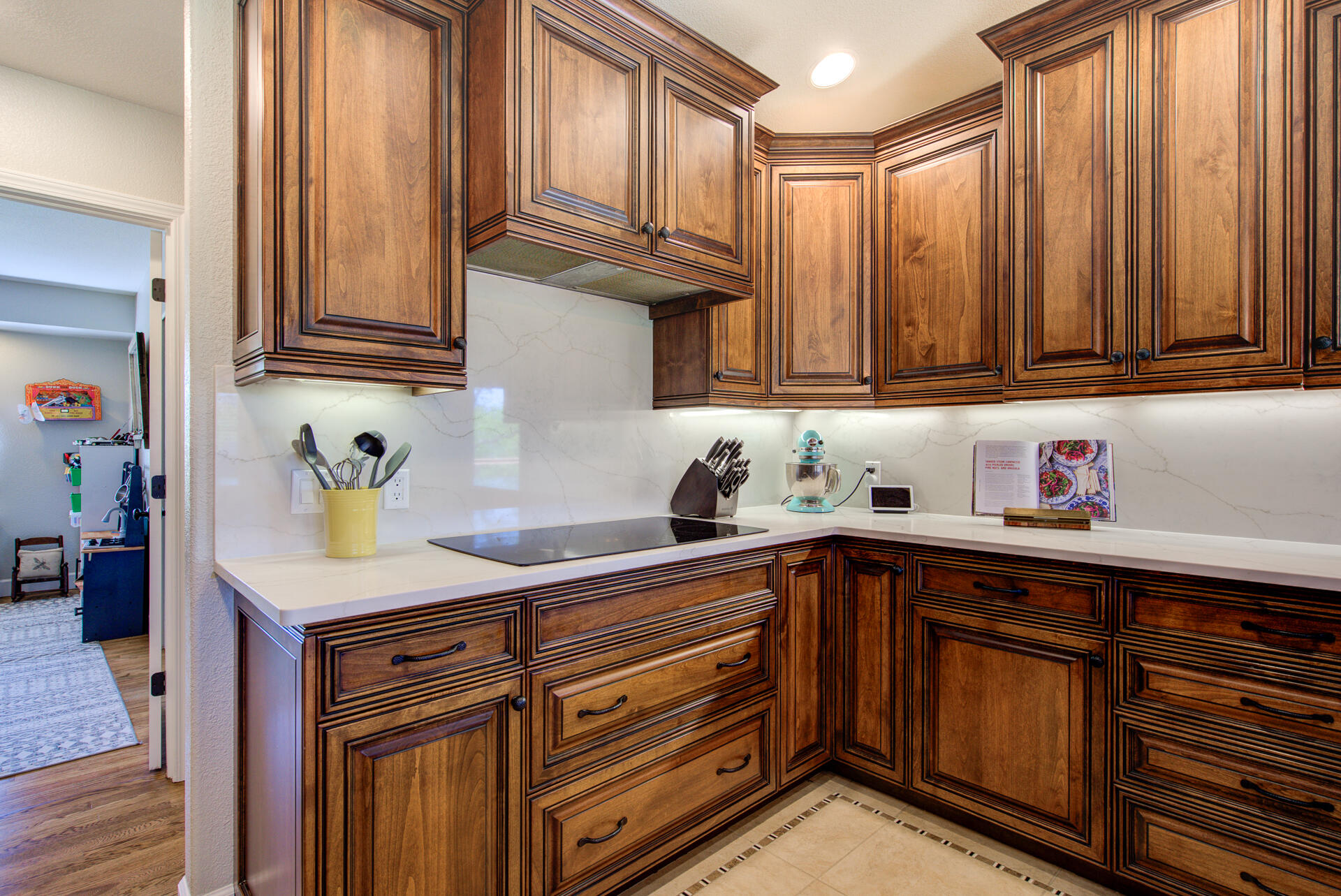 13416 Luna Drive Redding, CA 96003 - Photo 24 of 64 a kitchen with granite countertop cabinets and window