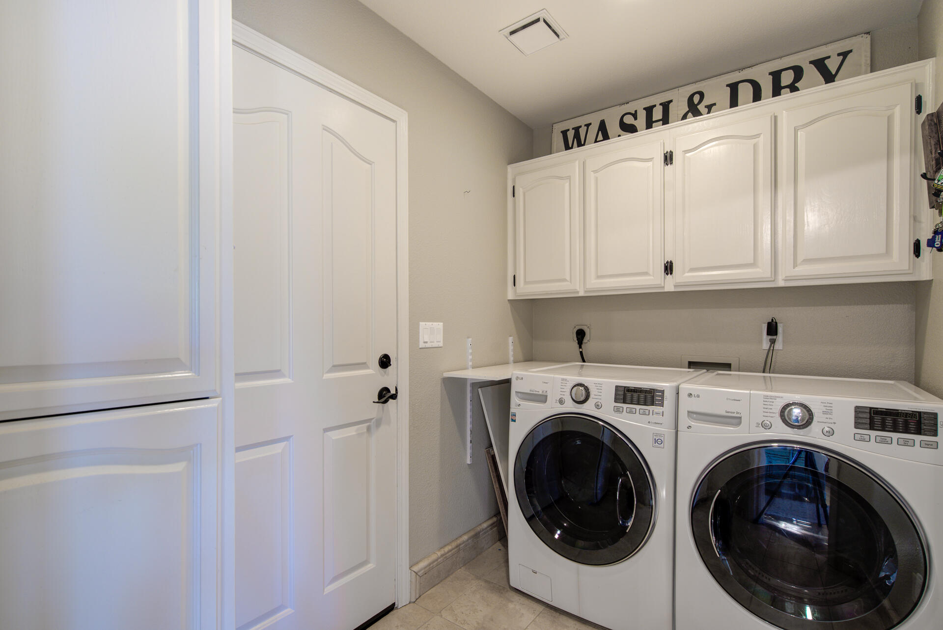 13416 Luna Drive Redding, CA 96003 - Photo 30 of 64 a view of a hallway with washer and dryer