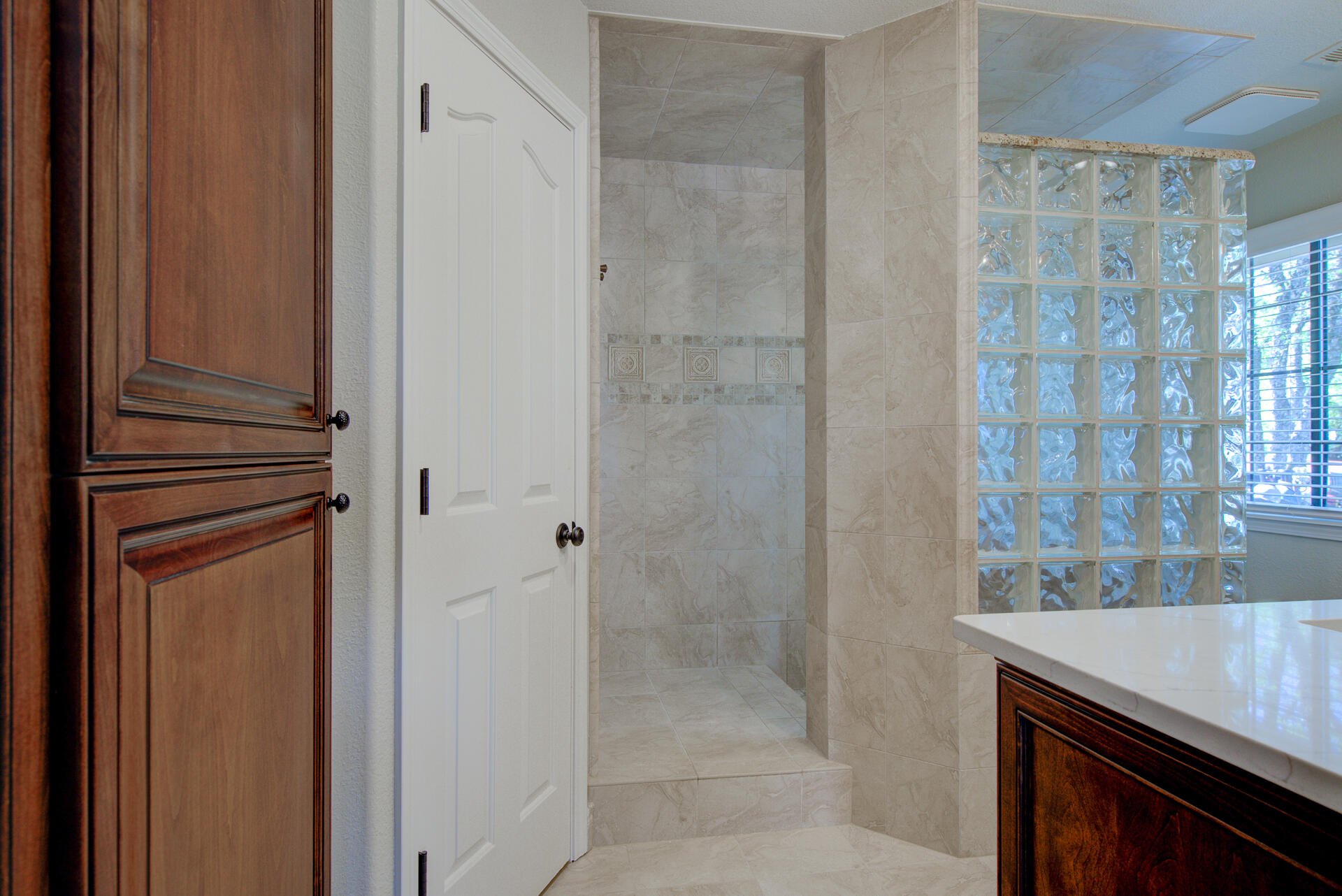 13416 Luna Drive Redding, CA 96003 - Photo 33 of 64 a bathroom with a granite countertop shower a mirror and a sink