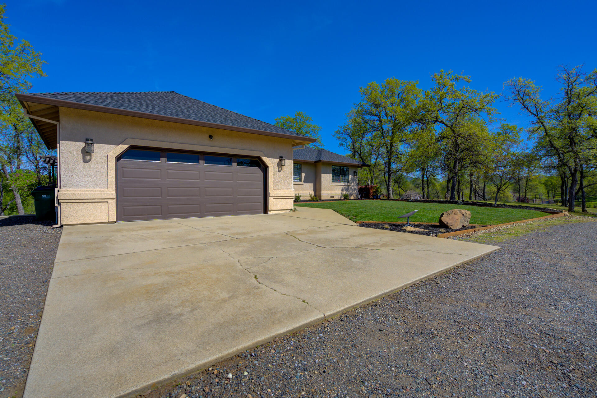 13416 Luna Drive Redding, CA 96003 - Photo 4 of 64 a front view of a house with a yard and garage