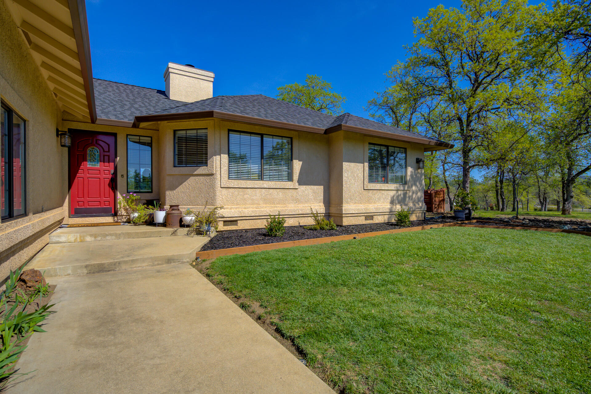 13416 Luna Drive Redding, CA 96003 - Photo 5 of 64 a view of a house with a backyard
