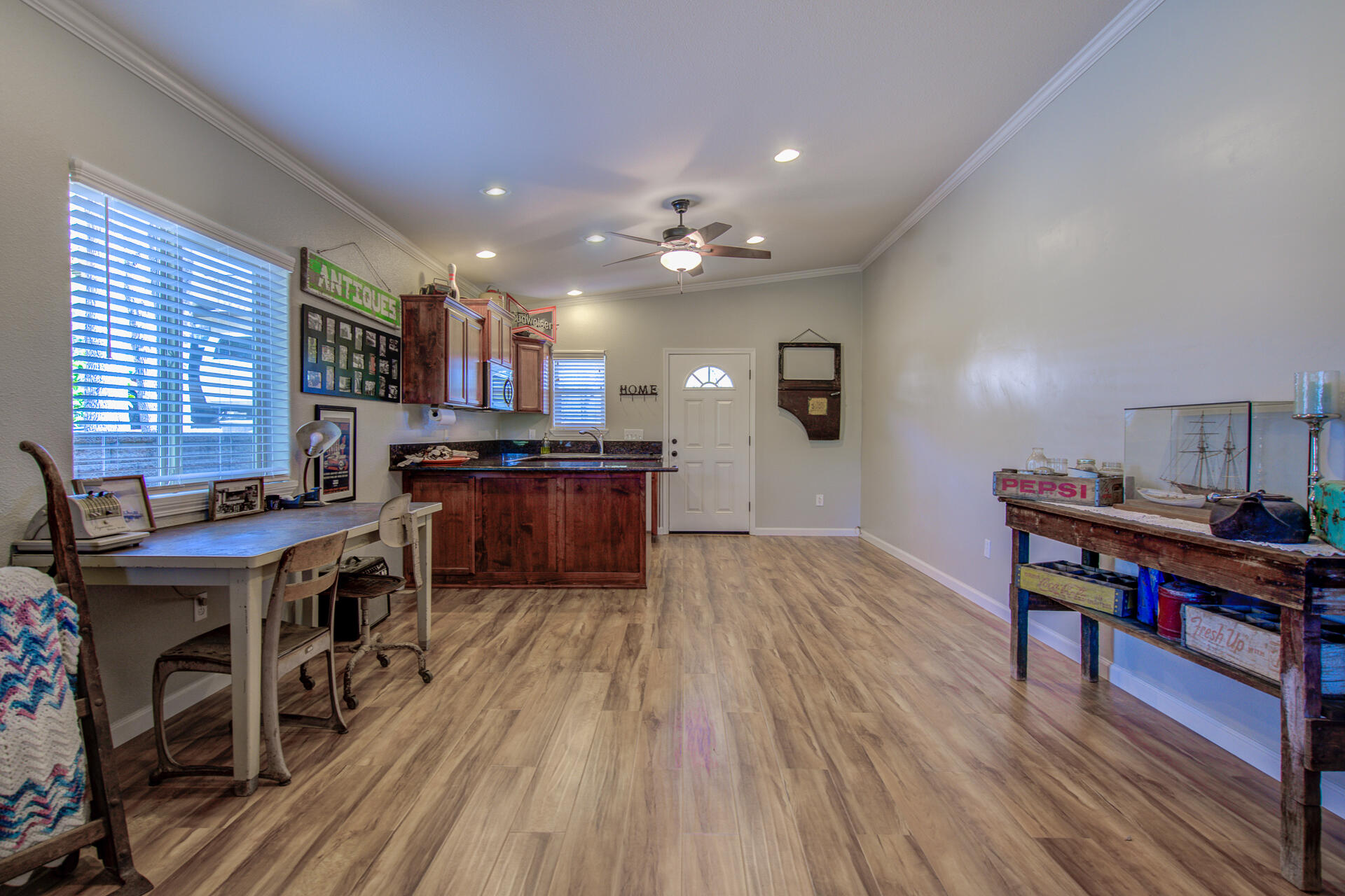 13416 Luna Drive Redding, CA 96003 - Photo 51 of 64 a kitchen with stainless steel appliances granite countertop a stove top oven a dining table and chairs with wooden floor