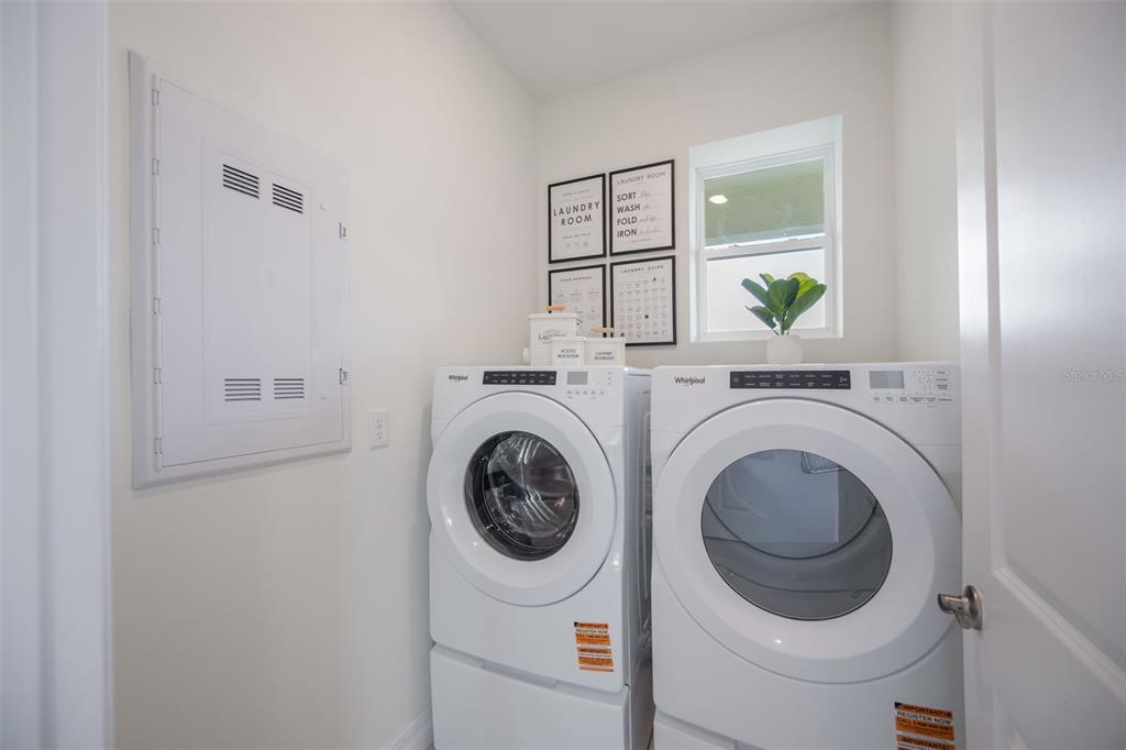 3973 Kennebunk Loop Mount Dora, FL 32757 - Photo 32 of 37 a utility room with dryer and washer