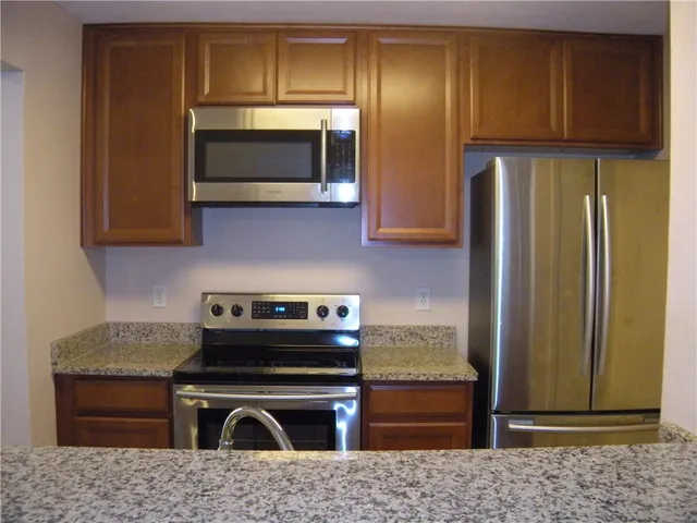a kitchen with a stove and a microwave