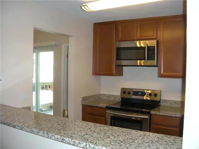 a kitchen with a stove and a cabinet