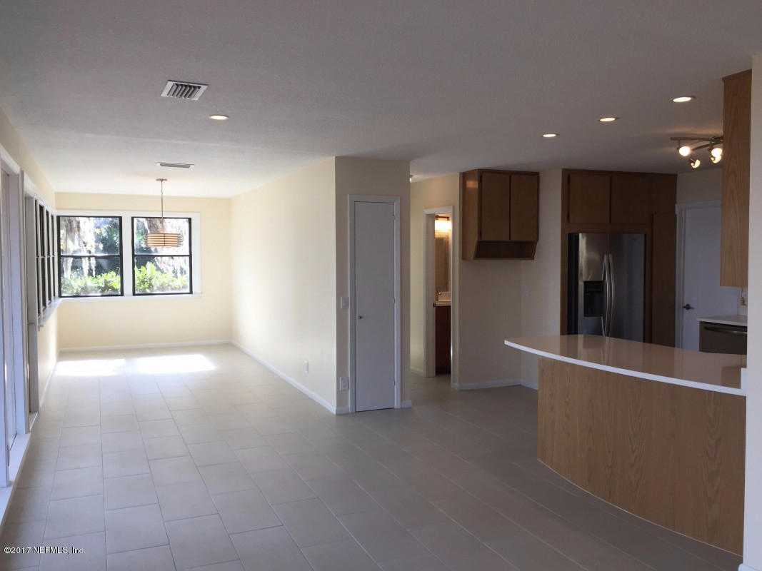 4127 Magnolia Road Orange Park, FL 32065 - Photo 11 of 24 wooden floor in an empty room with a window
