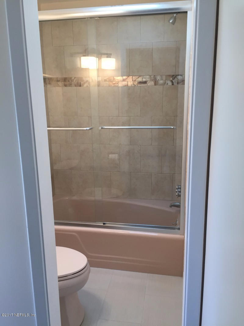 4127 Magnolia Road Orange Park, FL 32065 - Photo 12 of 24 a bathroom with a shower and a toilet