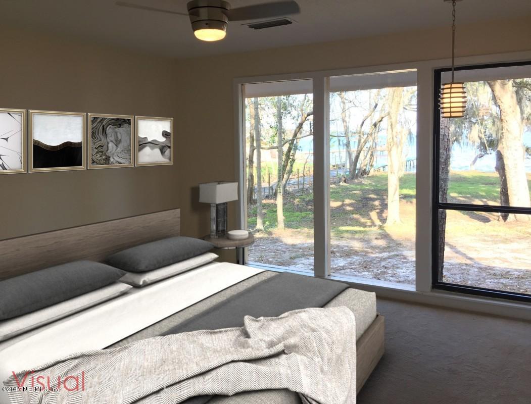 4127 Magnolia Road Orange Park, FL 32065 - Photo 15 of 24 a bedroom with a large bed and a large window