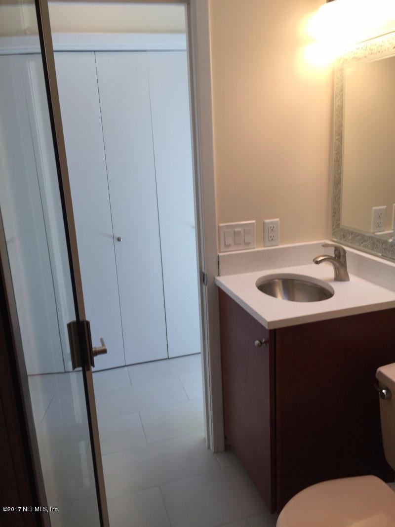 4127 Magnolia Road Orange Park, FL 32065 - Photo 20 of 24 a bathroom with a sink and mirror with toilet