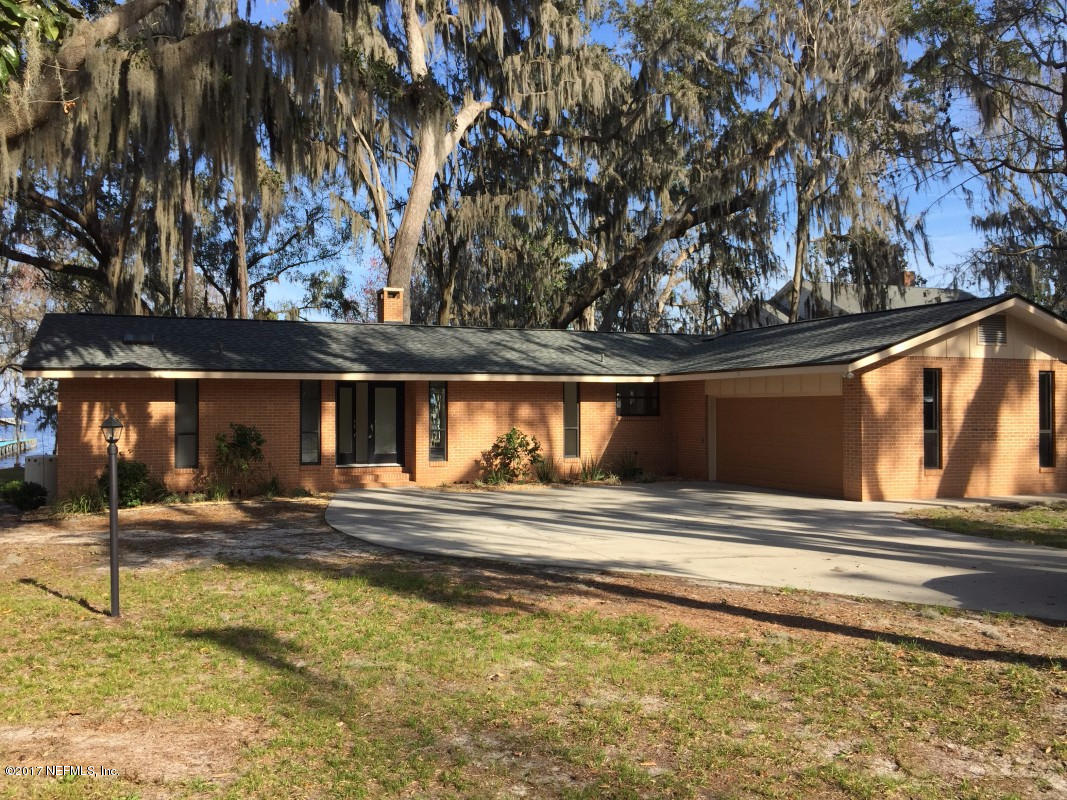 4127 Magnolia Road Orange Park, FL 32065 - Photo 2 of 24 a view of a house with a swimming pool
