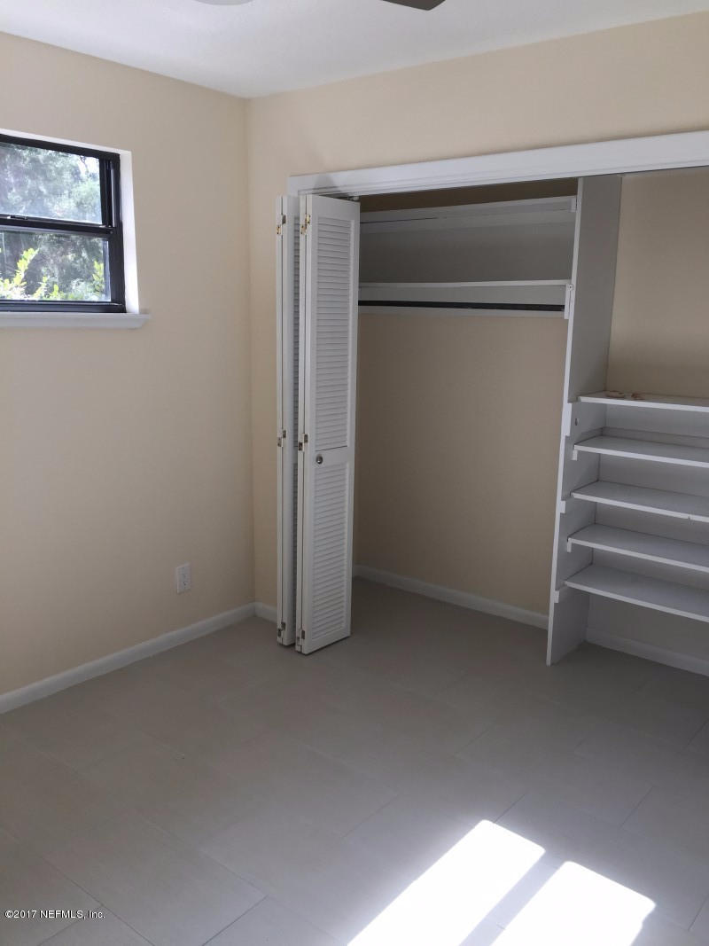 4127 Magnolia Road Orange Park, FL 32065 - Photo 23 of 24 a view of room with stairs and a closet