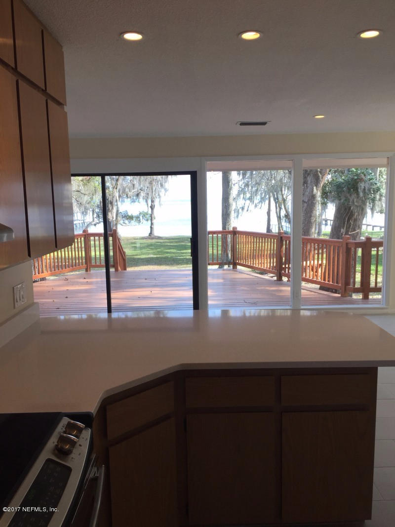 4127 Magnolia Road Orange Park, FL 32065 - Photo 9 of 24 a kitchen with a sink and large window