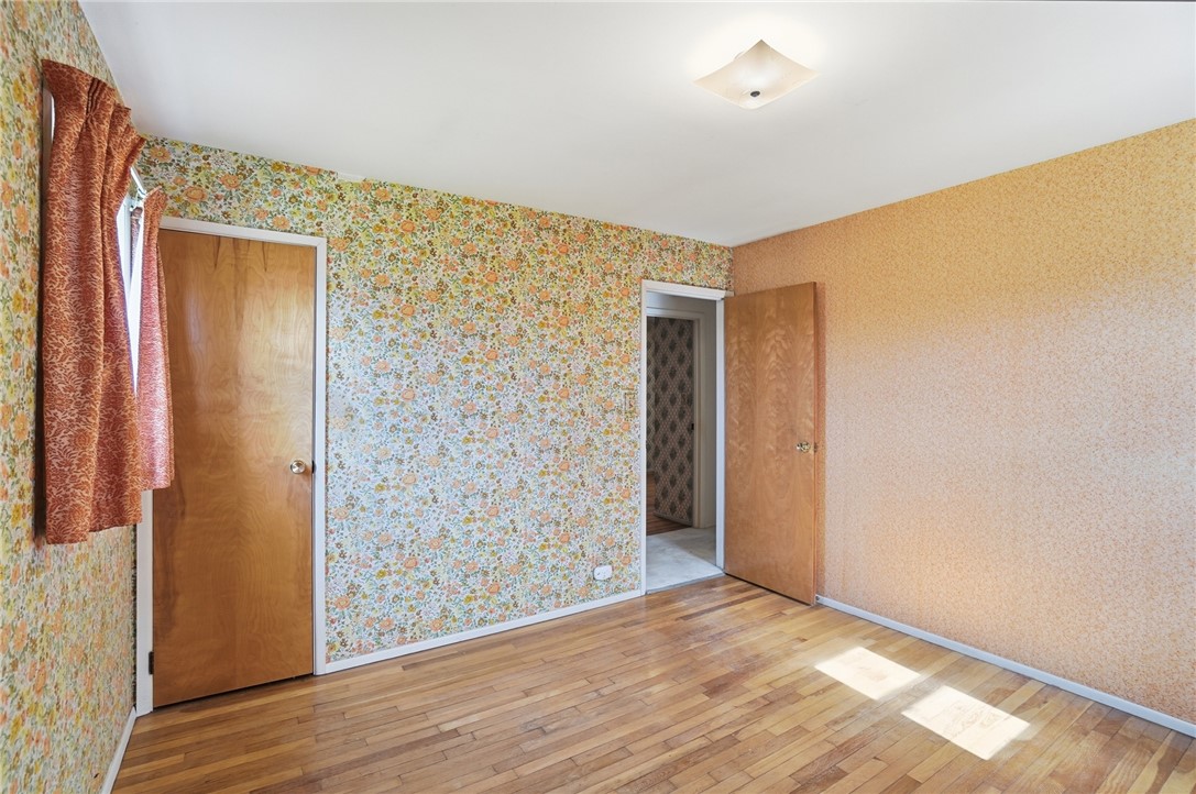 1087 Fairfield Road Troy, OH 45373 - Photo 16 of 39 This bright room features beautiful hardwood floors and multiple access points.