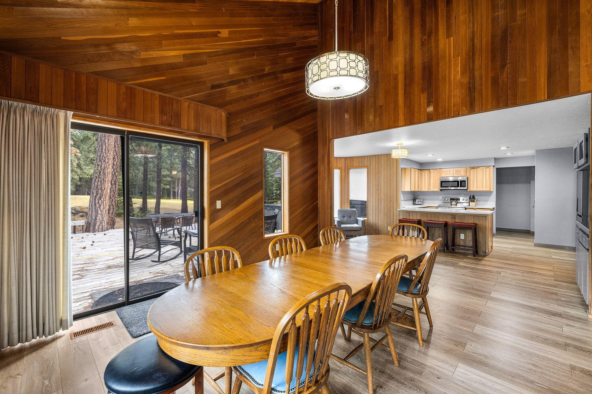 13168 Hawks Beard Black Butte Ranch, OR 97759 - Photo 7 of 47 a dining room with furniture a chandelier and wooden floor