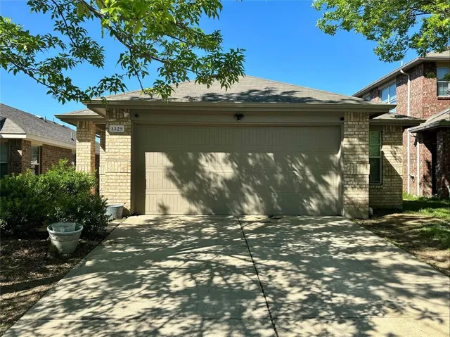 a view of a house with a tree