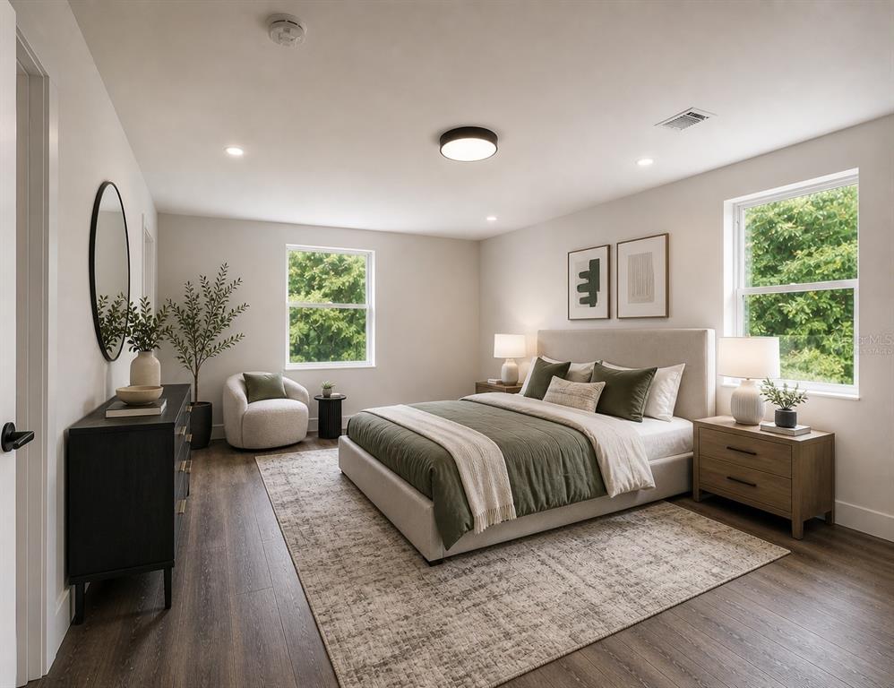 2440 Wallace Road Bartow, FL 33830 - Photo 16 of 27 a spacious bedroom with a large bed and windows