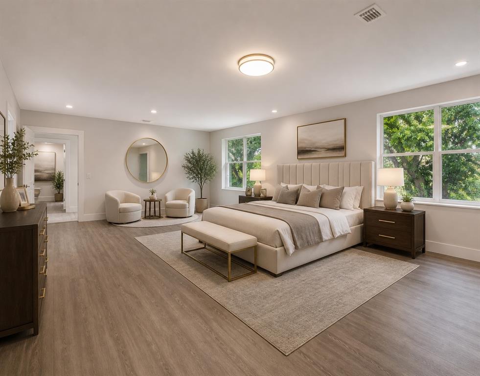 2440 Wallace Road Bartow, FL 33830 - Photo 19 of 27 a spacious bedroom with a large bed and a large window