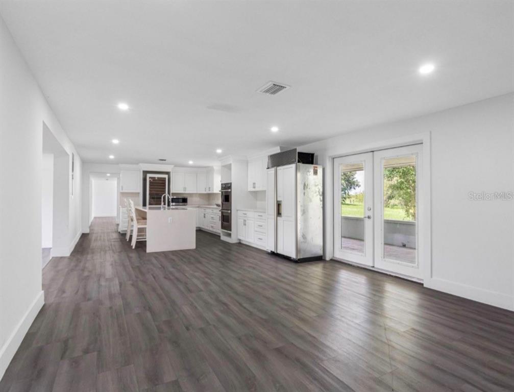 2440 Wallace Road Bartow, FL 33830 - Photo 9 of 27 a view of a kitchen with wooden floor and electronic appliances