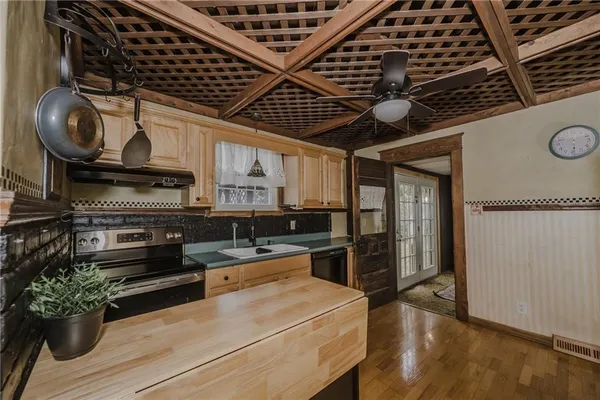 a view of a room with wooden floor backyard and windows