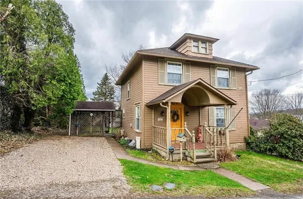 a front view of a house with a yard